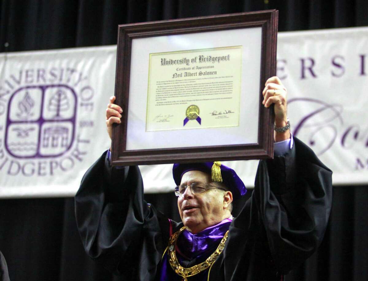 University of Bridgeport President Neil Salonen receives an Certificate of Appreciation during the school's 108th Commencement Ceremony at Webster Bank Arena in Bridgeport, Conn. on Saturday May. 5, 2018. This is President Salonen's final graduation before retiring.