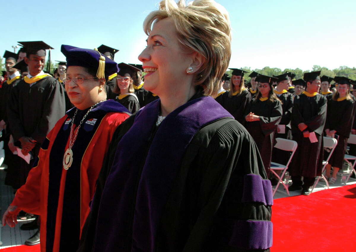 Sen. Hillary Rodham Clinton walks by RPI graduates with college president Shirley Ann Jackson, left, during commencement exercises in 2005.