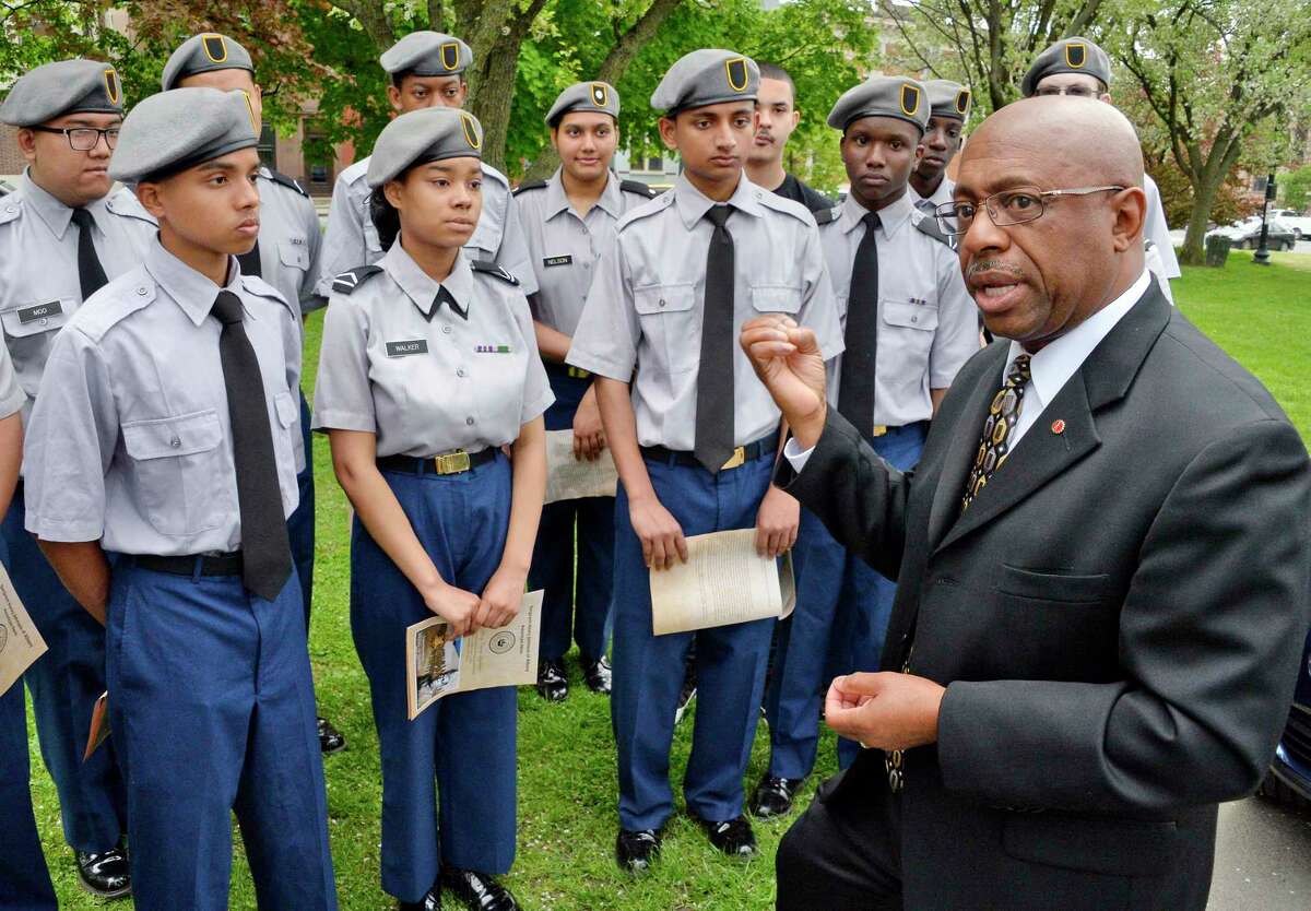 Command Sergeant Major Louis Wilson of the New York National Guard (ret.) speaks with members of the Sgt. Henry Johnson Battalion JROTC of Albany High School during the 100th anniversary of Henry Johnson's defeat of nearly two dozen German soldiers, an act that won him the Medal of Honor during a ceremony in Washington Park Tuesday May 15, 2018 in Albany,NY. (John Carl D'Annibale/Times Union)