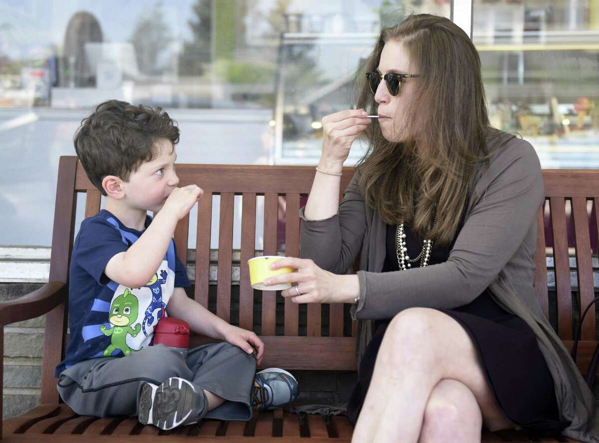 Greenwich resident Jessica Shapiro and her son, Asher, 3, enjoy gelato outside Gelato & Cioccolato in the Cos Cob section of Greenwich, Conn. Tuesday, May 8, 2018. The new shop offers original Italian gelato from a family recipe born in northeastern Italy near Venice.