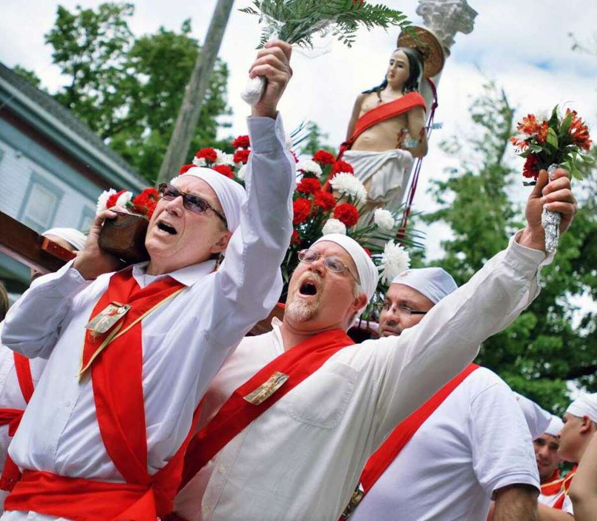 For nearly 100 years, the Feast of St. Sebastian has been celebrated in Middletown at the Roman Catholic Church on Washington Street. On Sunday, participants, barefoot and dressed in white with red sashes and carrying carnations, make their way to the church from the cemetery on Route 66 in Middlefield and the Italian Society on Court Street.