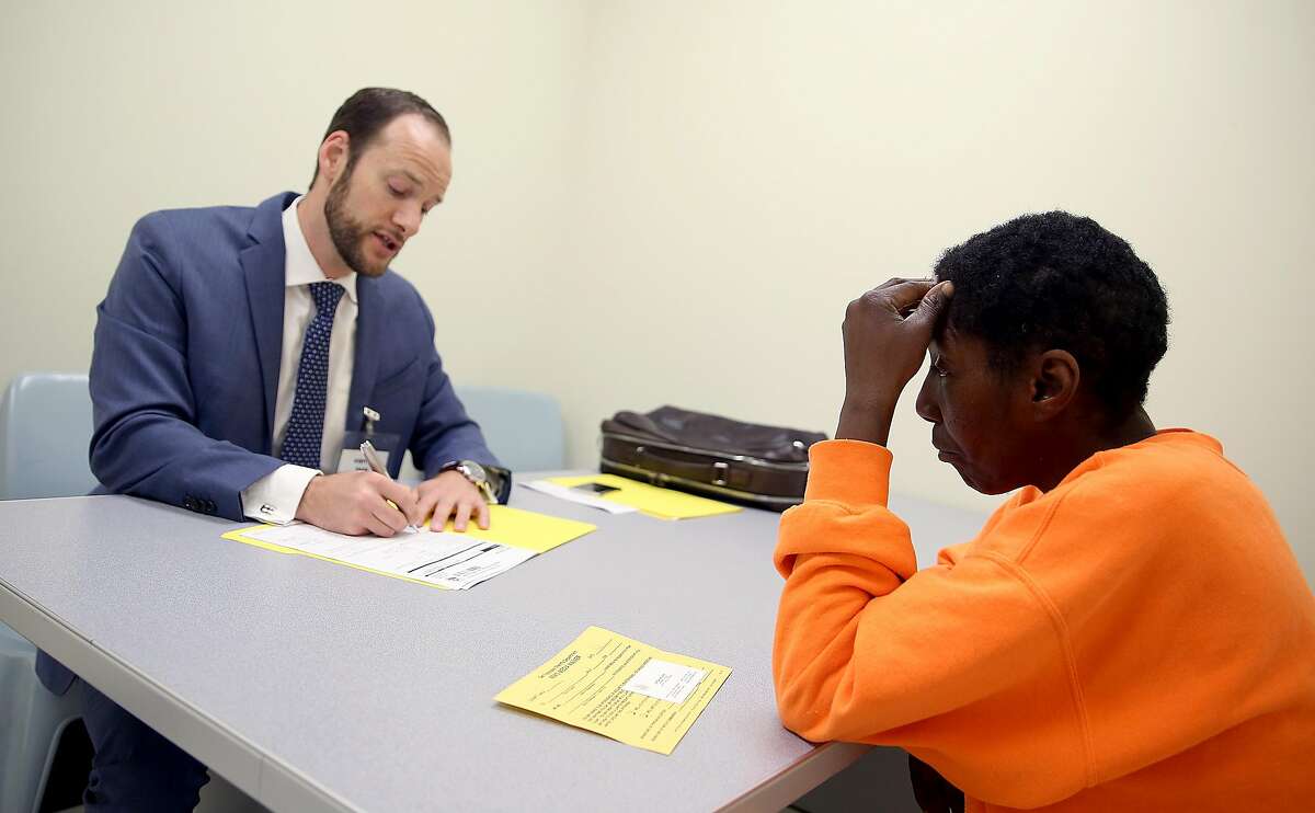 Deputy public defender Chesa Boudin (left) interviews inmate D.J.(right) in room #2 at county jail #2 as part of the public defender pretrial release unit on Monday, May 14, 2018 in San Francisco, Calif.