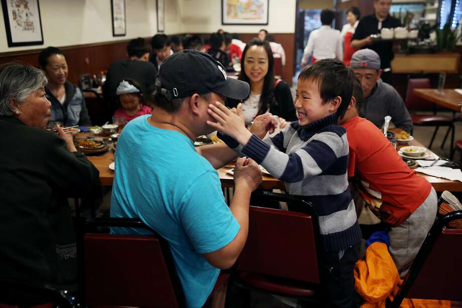 Alan Wang, 6, plays with his uncle Mark Dai at Brothers Restaurant, Saturday, May 12, 2018, in San Francisco, Calif. The Korean BBQ is located at 4128 Geary Blvd. Photo: Santiago Mejia / The Chronicle