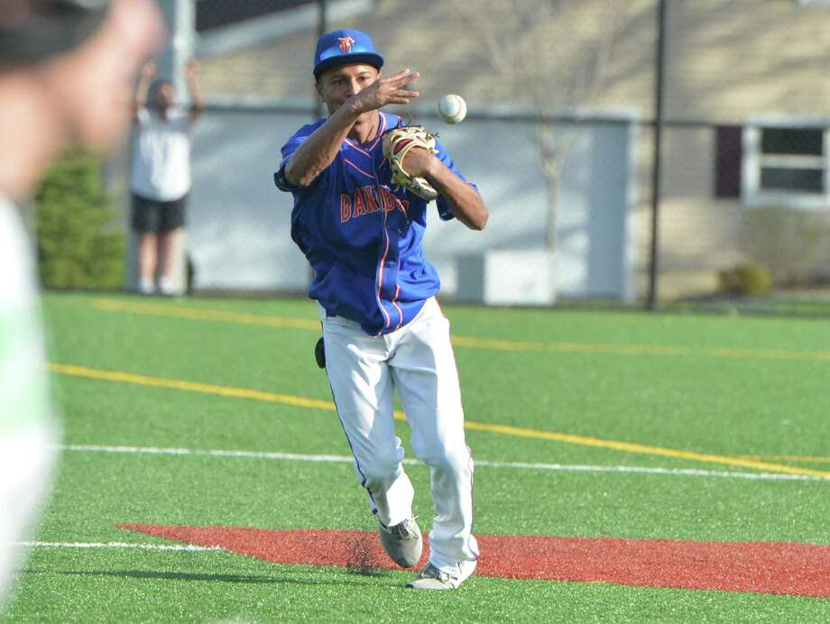 Danbury’s Javon Hernandez makes the throw to first base for the out against Norwalk on May 2. Photo: Alex Von Kleydorff / Hearst Connecticut Media / Norwalk Hour