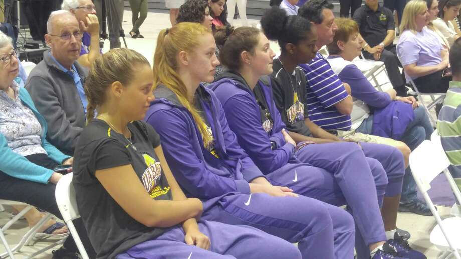 UAlbany basketball players (from left) Patricia Conroy, Heather Forster, Alexi Schecter and Chyanna Canada look on as Colleen Mullen is introduced as the school's new women's coach Tuesday, May 15, 2018. (Pete Dougherty/Times Union)