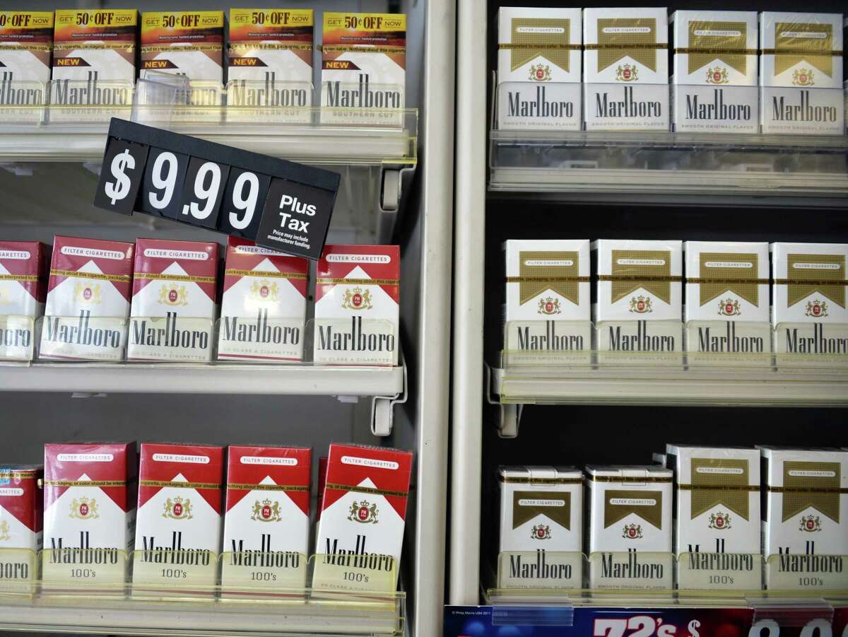 Cigarettes for sale at Coulson's at Newton Plaza on Wednesday, Feb. 5, 2014, in Colonie, N.Y. In a 26-11 vote, Albany County legislators on Monday approved a ban on the sale of tobacco and nicotine-based products in pharmacies as well as stores that contain them. (John Carl D'Annibale/Times Union archive)