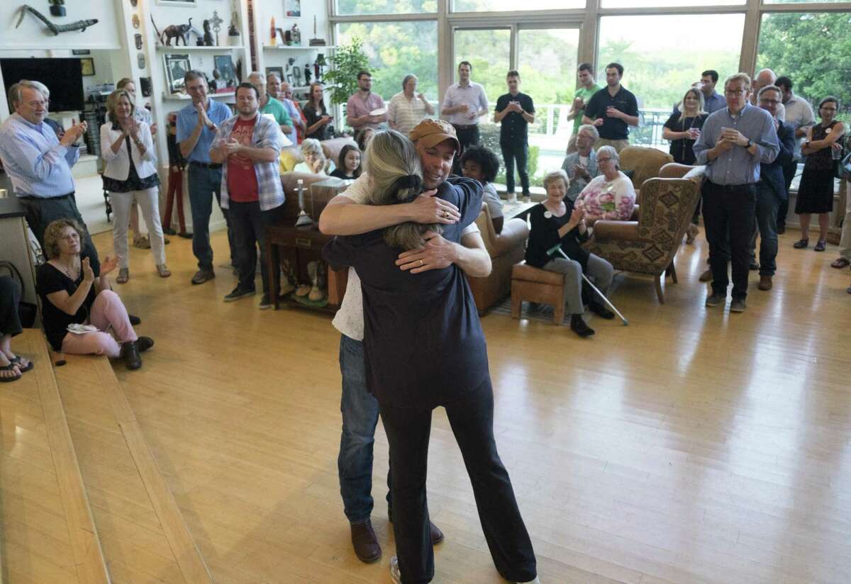 Joseph Kopser, a Democrat running for the 21st Congressional District, hugs former state Rep. Debra Danburg, who introduced him at a meet-and-greet event in south Austin.