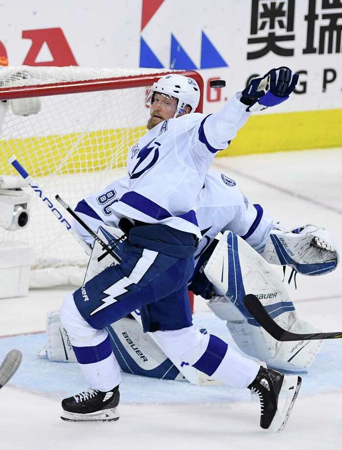 Tampa Bay Lightning defenseman Anton Stralman (6) reaches for the puck during the second period of Game 3 of the NHL Eastern Conference finals hockey playoff series against the Washington Capitals, Tuesday, May 15, 2018 in Washington. (AP Photo/Nick Wass) Photo: Nick Wass / FR67404 AP