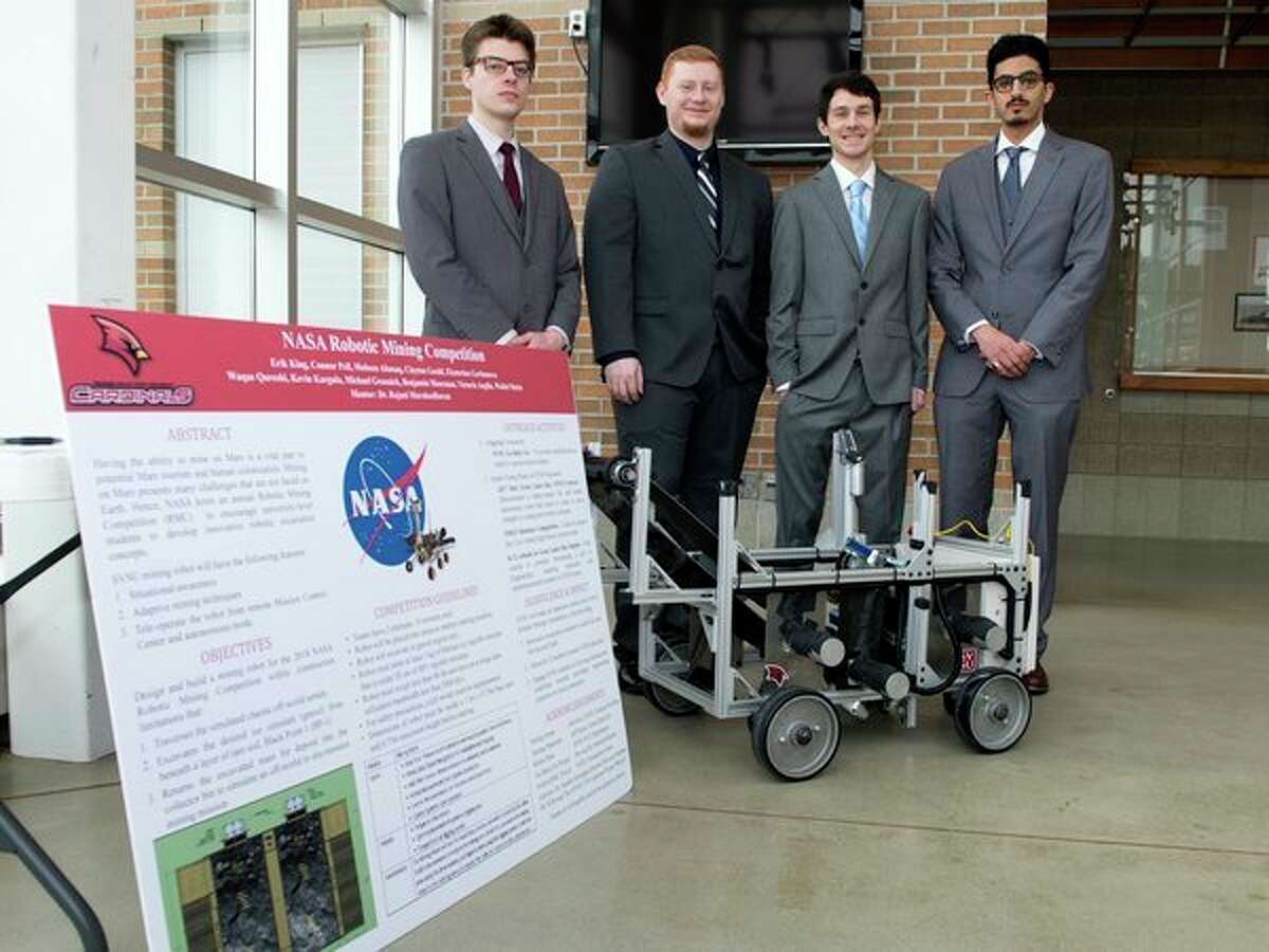 Four of the Saginaw Valley State University students who have designed a robot prototype for the NASA Robotics Mining Competition at the Kennedy Space Center in Florida this week pose for a photo. From left, Connor Peil, Erik King, Clayton Gould and Mohsen Abusaq; all are electrical engineering majors. (Photo provided/SVSU)