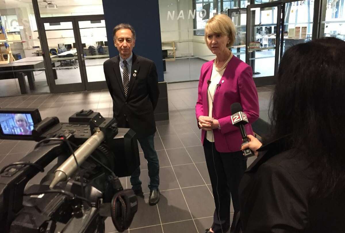 SUNY Chancellor Kristina Johnson, right, talks with reporters Tuesday along with SUNY Polytechnic Institute's interim president Bahgat Sammakia at the school's Utica campus on Tuesday