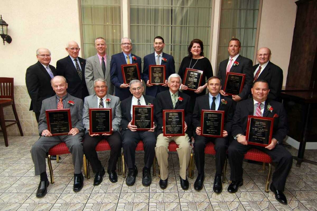 The Greater Bridgeport Athletic Association (Old Timers) honored a group of 10 at its 61st annual awards dinner on Monday at Testo’s Restaurant. Front row, from left: Jim Penders, Ed Sylvia, Charles Panullo, Mickey Buckimir, Mike Ambrose, and John Torres. Back row: Bob Baroni, GBAA Board of Directors chairman; Tom Kansasky, president; invited guest John Pfohl, Kolbe-Cathedral CIAC Boys’ Class IV state baskeball champions; Larry Menta, Craig Zysk, Tricia Fabbri, Keith Webster and Deacon Frank Masso of St. Lawrence Church, Shelton. Fabbri, Ambrose, Webster and Zysk were received Outstanding Athletic Achievement awards while Torres, Menta, Penders and Sylvia were recognized for their contributions to youth athletic, recreational and educational programs. Panulllo and Buckmir were presented GBAA Lifetime Achievement Awards. Chris Watts, boys coach of CIAC Class I state basketball champion Notre Dame-Fairfield was invited but unable to attend.