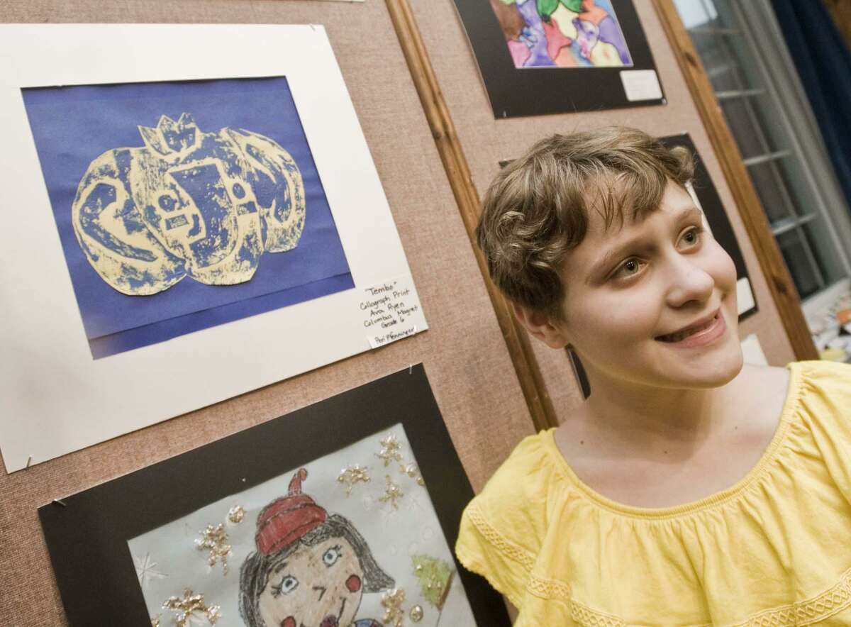 Ava Ryen, sixth-grade at Columbus Magnet School, with her collagraph print at the Norwalk Public Schools art show opening in the community room of City Hall. Tuesday, May 15, 2018