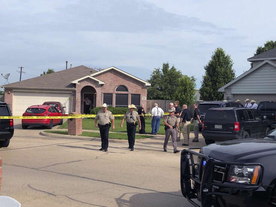 Denton County Sheriff Deputies work the scene of a shooting in Ponder, Texas where multiple people died Wednesday, May 16, according to Capt. Orlando Hinojosa, a spokesman for the Denton County Sheriff's Office.  (Julian Gill/The Denton Record-Chronicle via AP) Photo: Julian Gill/Associated Press
