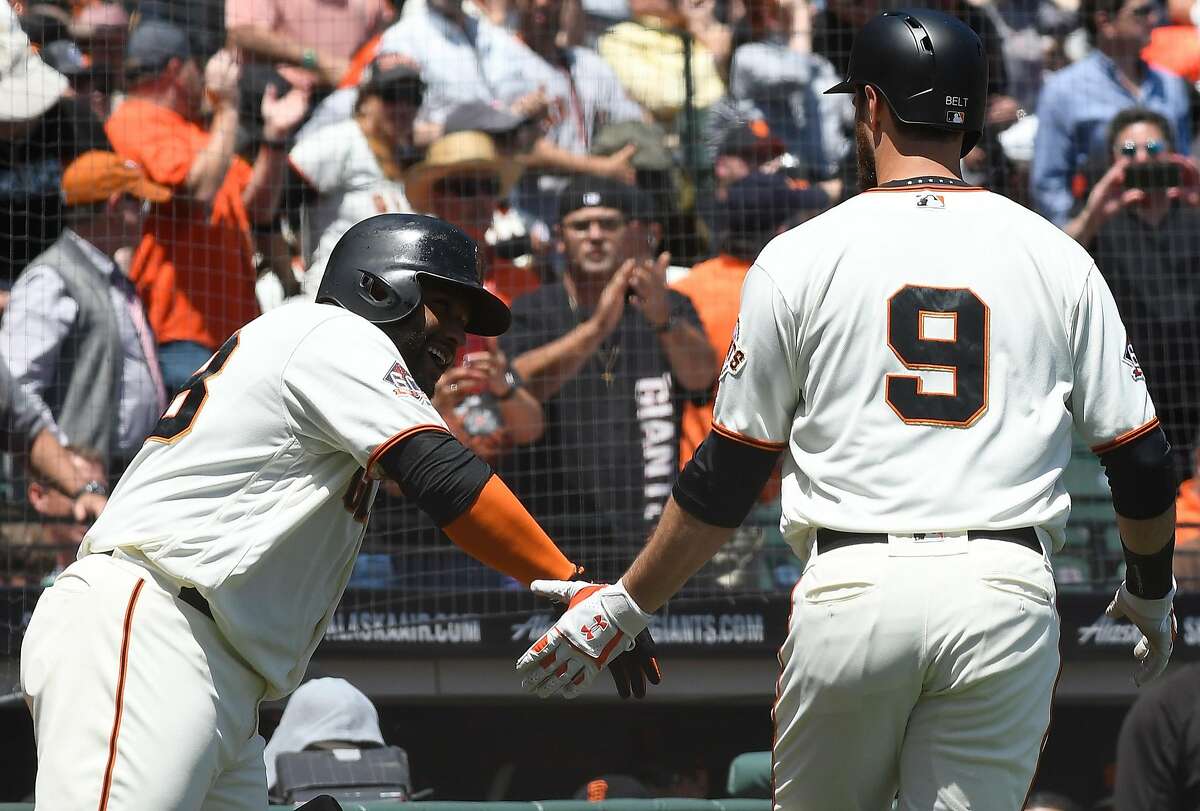 SAN FRANCISCO, CA - MAY 16: Brandon Belt #9 of the San Francisco Giants is congratulated by Pablo Sandoval #48 after Belt hit a solo home run against the Cincinnati Reds in the bottom of the third inning at AT&T Park on May 16, 2018 in San Francisco, California. (Photo by Thearon W. Henderson/Getty Images)
