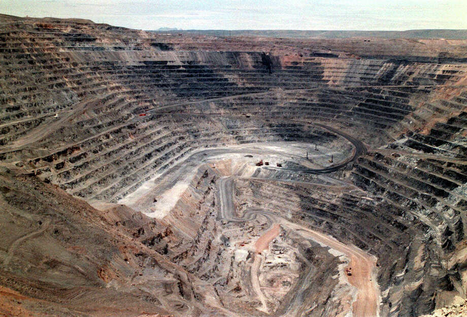 FILE - This undated file photo shows Barrick Goldstrike Mines' Betze-Post open pit near Carlin, Nev. Environmental groups challenged the Trump administration in federal court Wednesday, May 16, 2018, over its rejection of an Obama-era proposal that would have required mining companies to prove they have enough money to clean up their pollution. (Adella Harding/The Daily Free Press via AP, File) Photo: Adella Harding / The Daily Free Press