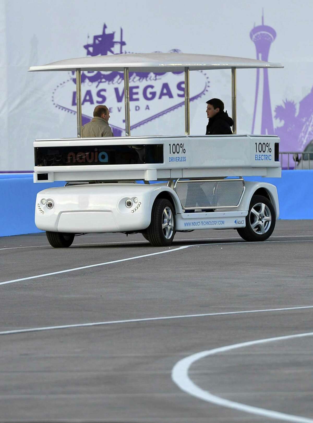 Induct demonstrates their new Navia driverless shuttle at the International Consumer Electronics Show, Monday, Jan. 6, 2014, in Las Vegas. (AP Photo/Jack Dempsey)