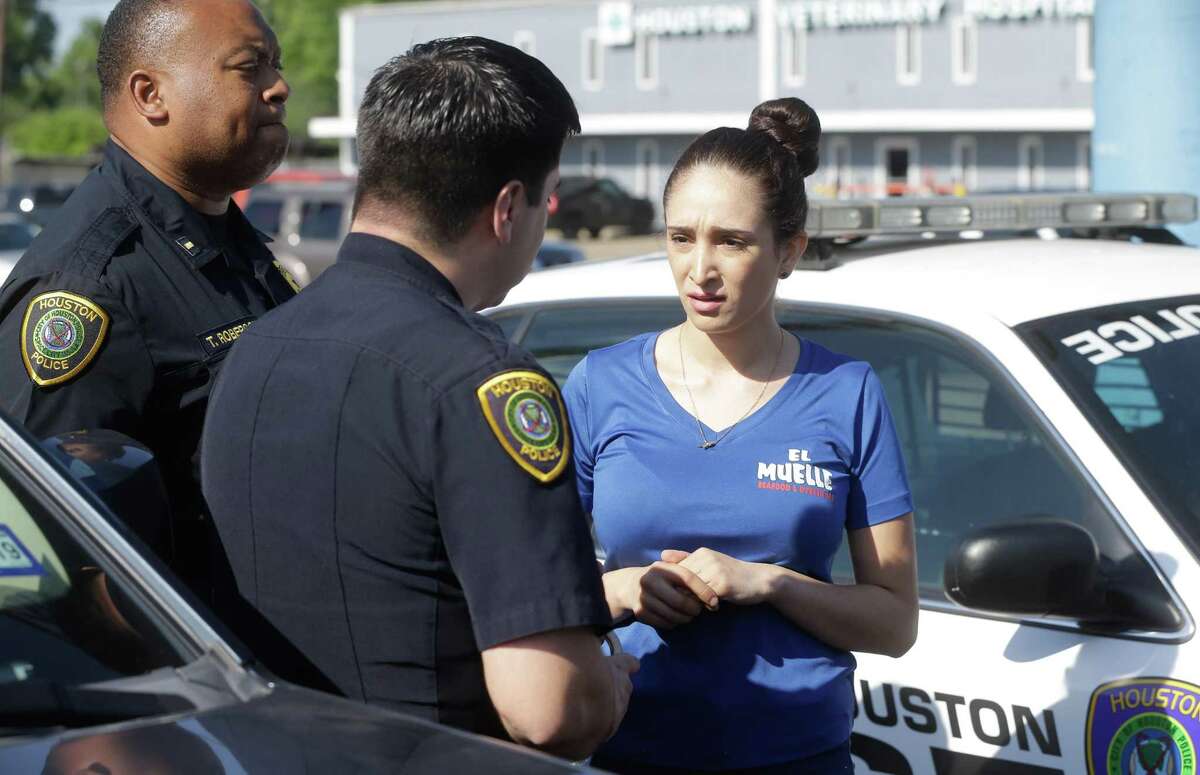 Houston Police officers arrest Natalia Ortiz at El Muelle Seafood, 6705 Airline Dr. Wednesday, May 16, 2018, in Houston. Prosecutors say she is the bartender who served Edin Palacios 11 beers the night in May 2016 when he got drunk and fled police and crashed into and killed Jocelynn Valero, 18, who was on her way home from prom.