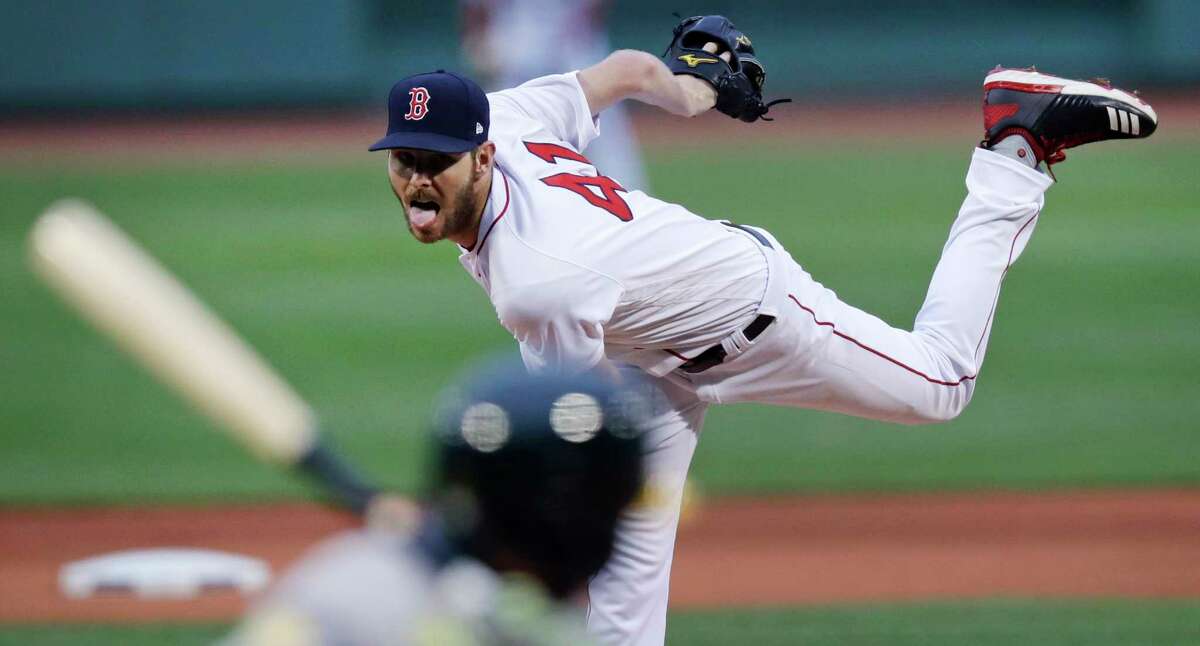 Boston Red Sox starting pitcher Chris Sale delivers during the first inning of the team's baseball game against the Oakland Athletics at Fenway Park in Boston, Wednesday, May 16, 2018. (AP Photo/Charles Krupa)