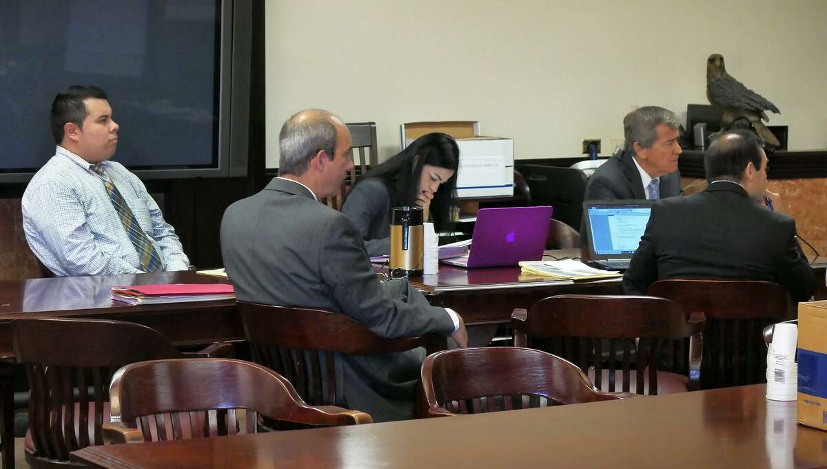 Luis Mercado, left, and his attorneys listen to testimony Wednesday in the 406th District Court.