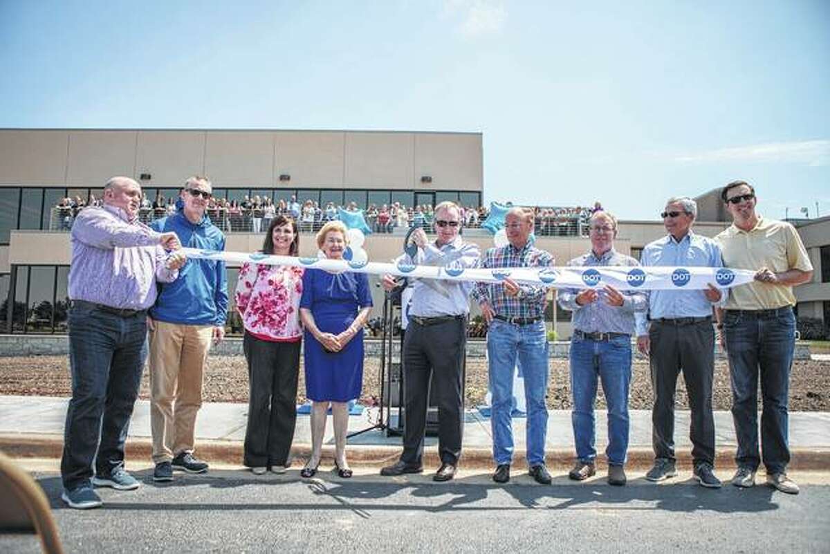Dot Foods opened a new $14 million expansion. Pictured left to right: Matt Holt, vice president of Human Resources; Dick Tracy, president; Anita Montgomery, chief financial officer; Dorothy Tracy, Dot Foods co-founder; Joe Tracy, CEO; John Long, Sr. vice president of Warehousing; Bill Mummey, director of Corporate Facilities; John Tracy, executive chairman; and Cullen Andrews, vice president of Sales and Marketing.