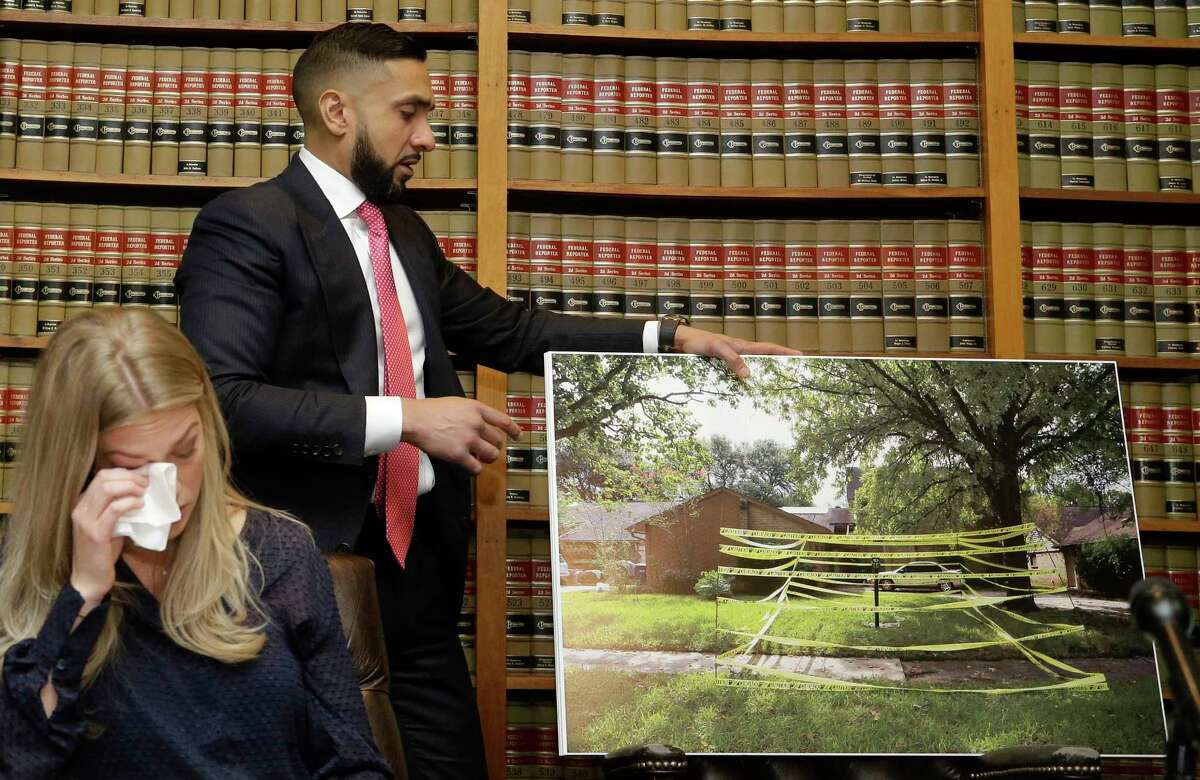 Alyssa Davidson, left, wipes her tears as attorney Muhammad Aziz displays a photo of the area where her brother, Andrew Pasek, was electrocuted and died while going to her home to save cat during the aftermath of Harvey, shown during a press conference at Abraham, Watkins, Nichols, Sorrels, Agosto & Aziz, 800 Commerce St., Wednesday, May 16, 2018, in Houston. The family is suing several companies, including CenterPoint Energy.