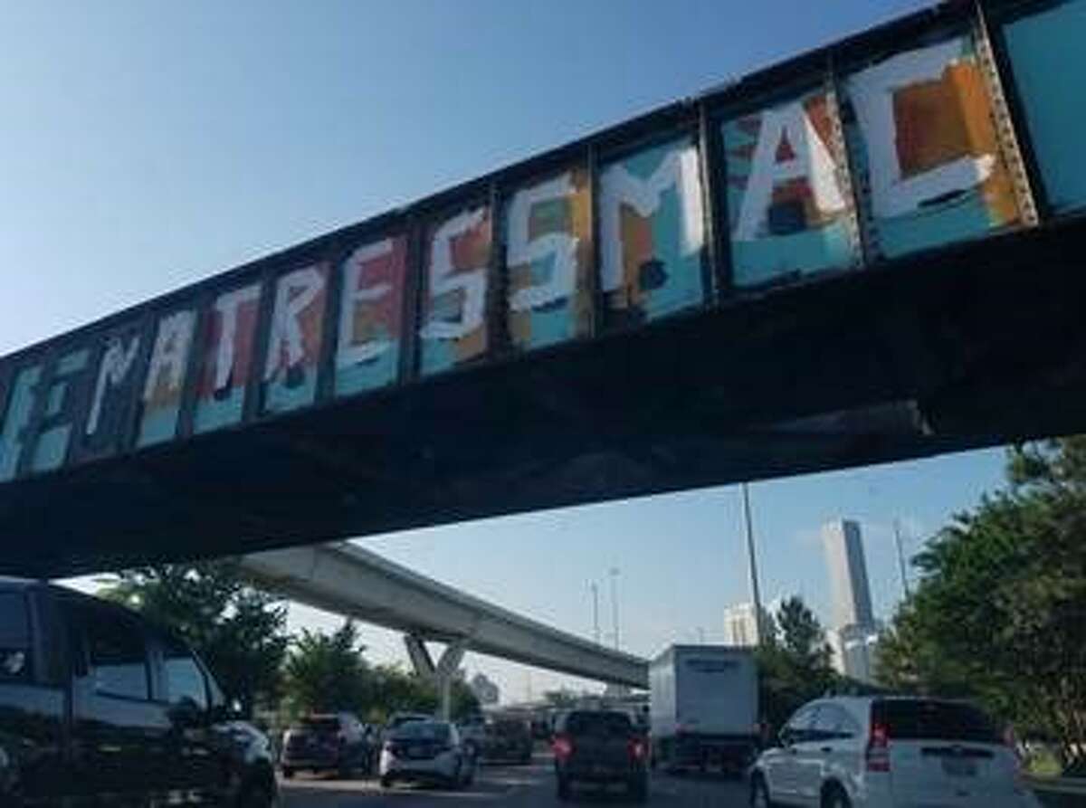 On Thursday morning commuters driving south down I-45 just outside downtown may have noticed the 'Be Someone' graffiti had been altered. The popular message, one of the city's most recognizable sights and examples of Houston street art, now reads "BE MATRESS MAC" in large white letters.