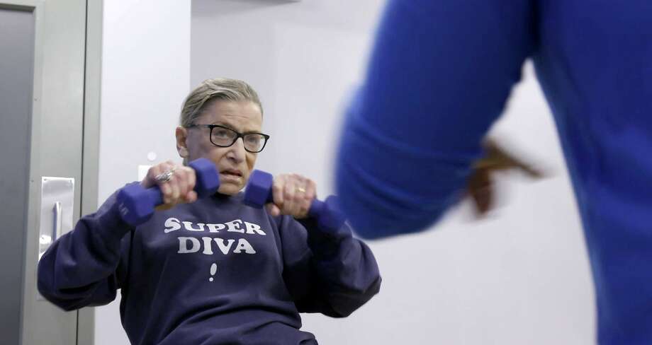 This image published by Magnolia Pictures shows Judge Ruth Bader Ginsberg, a US Supreme Court justice, working in a 