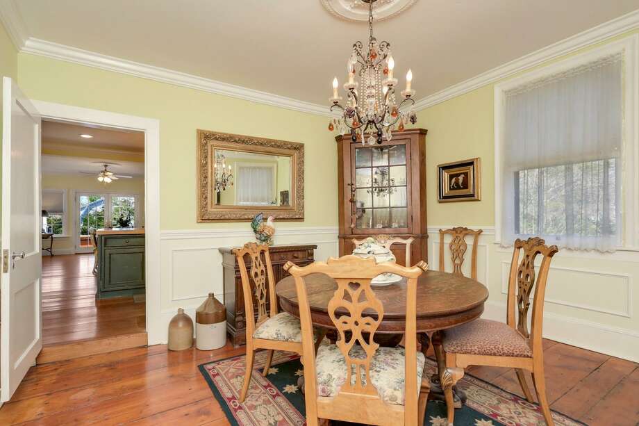 The 3,271-square foot Greek revival at 1745 Huntington Turnpike in Trumbull was built in 1838, a fact memorialized by the home's door knocker, which reads "Edwards 1838." The knocker is one of many traces of the home's rich history that remain in the home, with others including most of the original wideboard floors. The house, built by Samuel Edwards, sits across from the Nichols green and 42 acres of private parkland. Photo: Contributed Photo / Contributed Photo / Connecticut Post Contributed