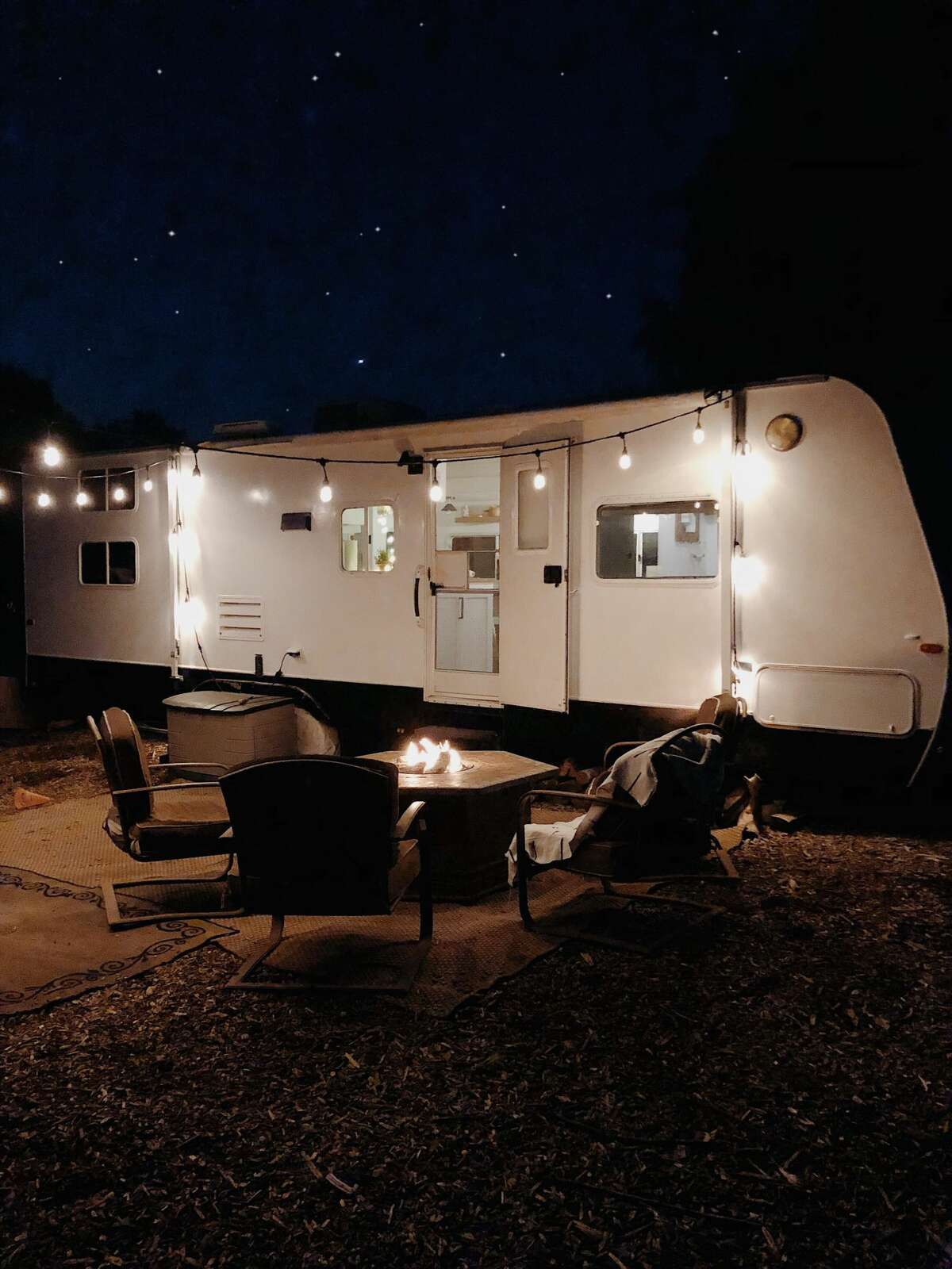A California family of five sold their five-bedroom home to buy a 2.2-acre piece of rural land in Ventura County. To save money to build their dream home on their land, they're living in a 150-square-foot fully renovated trailer. See photos of their groovy living situation on Instagram at @arrowsandbow.
