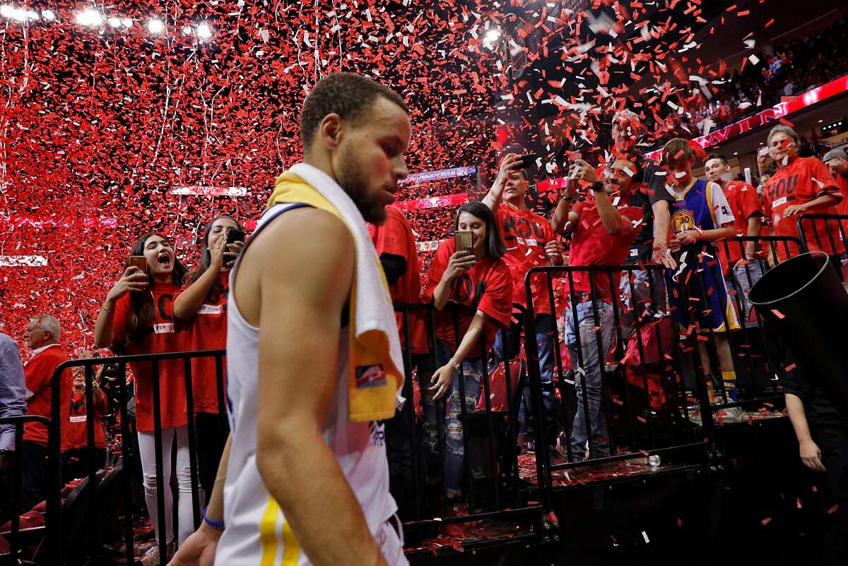 Rockets fans cheer as Stephen Curry (30) walks off the court after the Golden State Warriors were defeated by the Houston Rockets 127-105 in Game 2 of the Western Conference Finals at Toyota Center in Houston, Texas, on Wednesday, May 16, 2018.