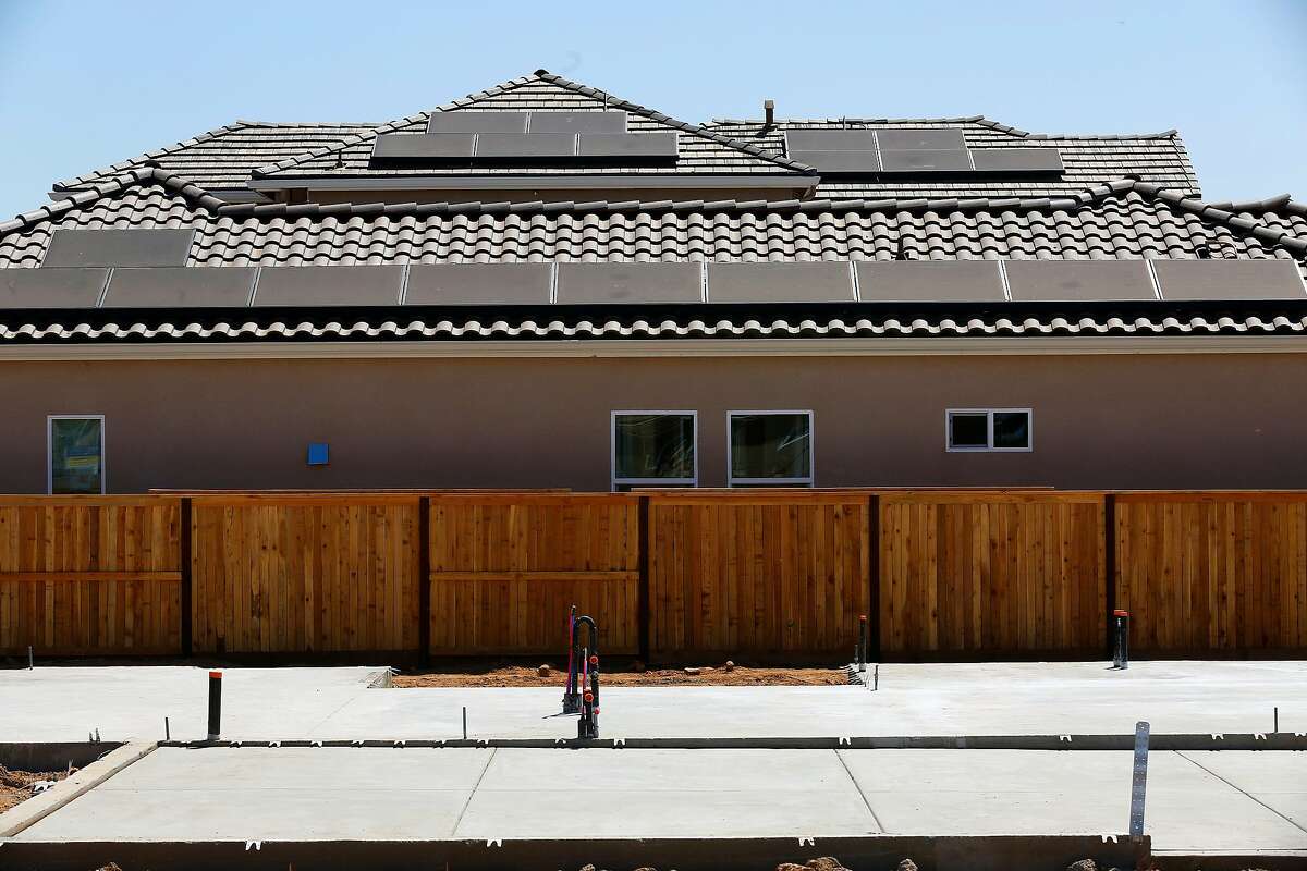 Solar panels are installed on the roofs of zero energy model homes, as seen on Thurs. May 17, 2018 in Clovis, Ca. The EnVision planned community, by De Young properties is the first of it's kind in Central California and largest in the State of California.