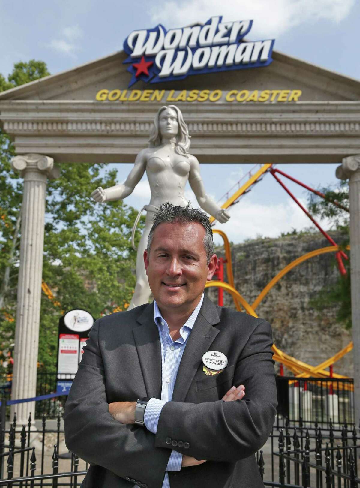 Six Flags Fiesta Texas president Jeffrey Siebert poses in front of Wonder Woman ride on Monday, May 14, 2018.