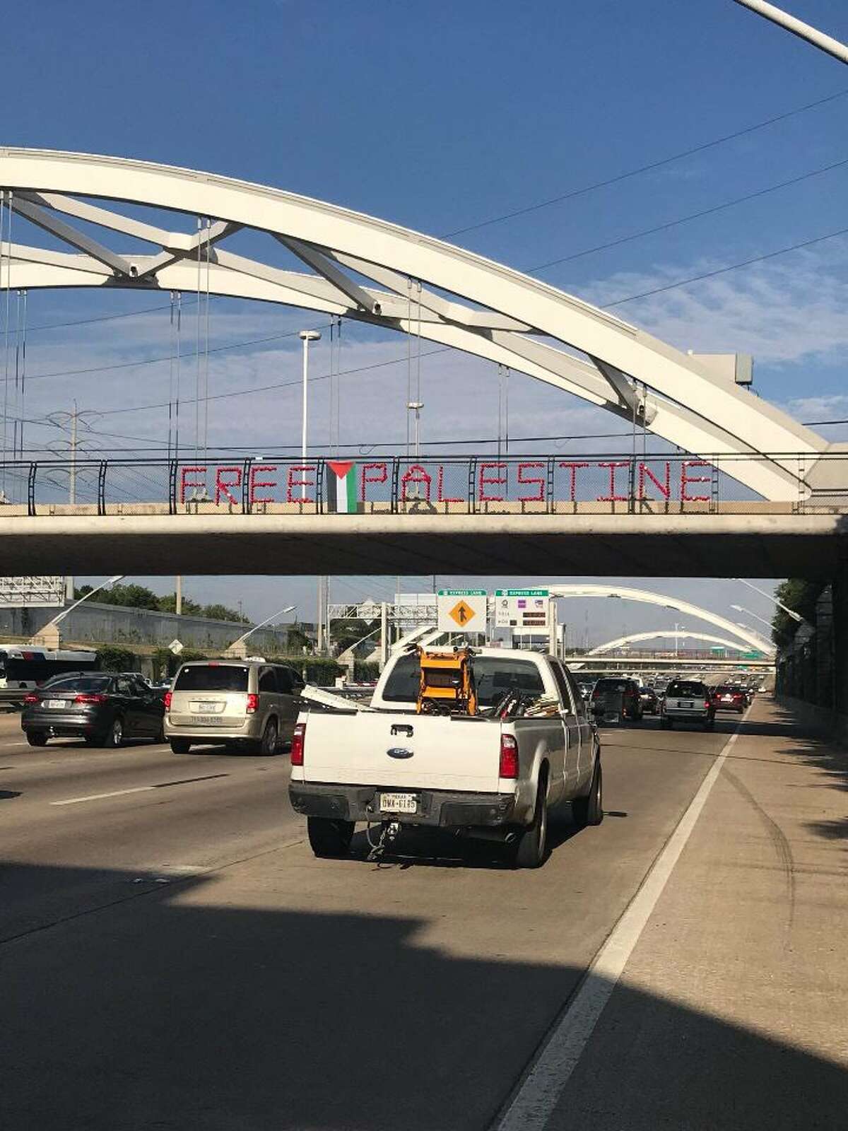 On Tuesday, student activists from the University of Houston hung up large protest signs reading "Free Palestine" and "Hands off Jerusalem" on the highway's iconic bridges. See photos of Gaza protests that have turned deadly his week.