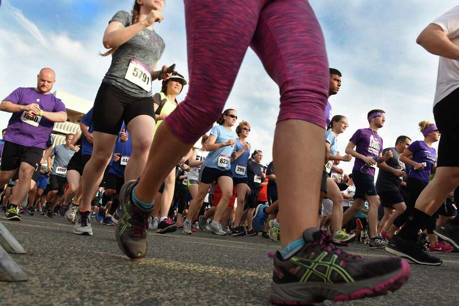Runners make their way up Madison Ave. in the CDPHP Workforce Team Challenge 5K on Thursday, May 17, 2018 in Albany, N.Y. (Lori Van Buren/Times Union) Photo: Lori Van Buren, Albany Times Union / 20043788A