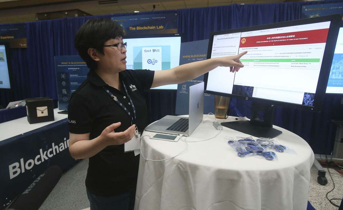Research engineer Minya Liang explains document verification by using what's called the Blockchain Lab December 12, 2017 at USAA's Innovation Day. The event showcases some of the latest concepts USAA is working on or has recently launched. In addition, representatives from Amazon, Google, Geekdom and the City of San Antonio also participated to share some of their latest innovative efforts.