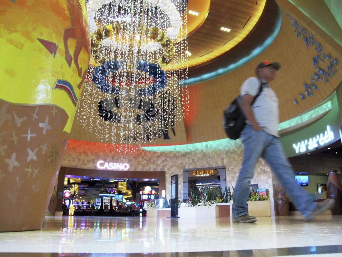 A man walks through the lobby of the Navajo Nation's Twin Arrows Casino, east of Flagstaff, Ariz., Tuesday, May 15, 2018. American Indian tribes are welcoming the opportunity to add sports betting to potentially hundreds of casinos across the country after the U.S. Supreme Court cleared the way for states to legalize it.