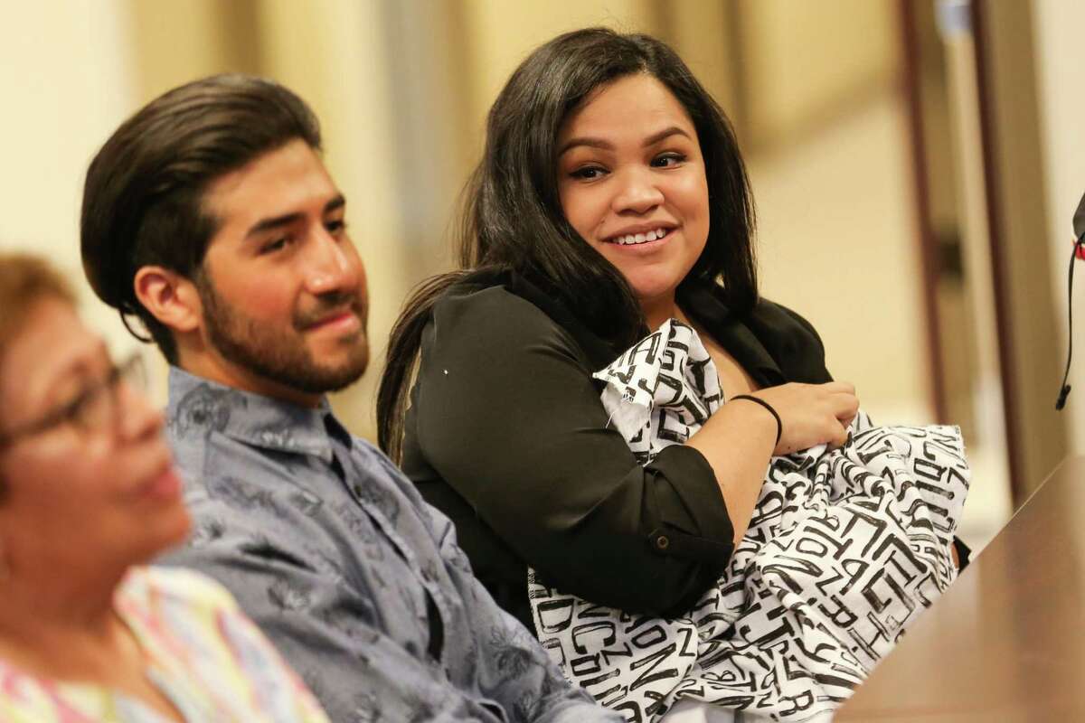 Andrea Barron holds 2-week-old Aaron Santiago Perez while accompanied by her husband Aaron Perez during a presentation celebrating the in-home delivery of her son by MCHD paramedics on Friday, May 18, 2018, at the Montgomery County Hospital District Administrative Building.