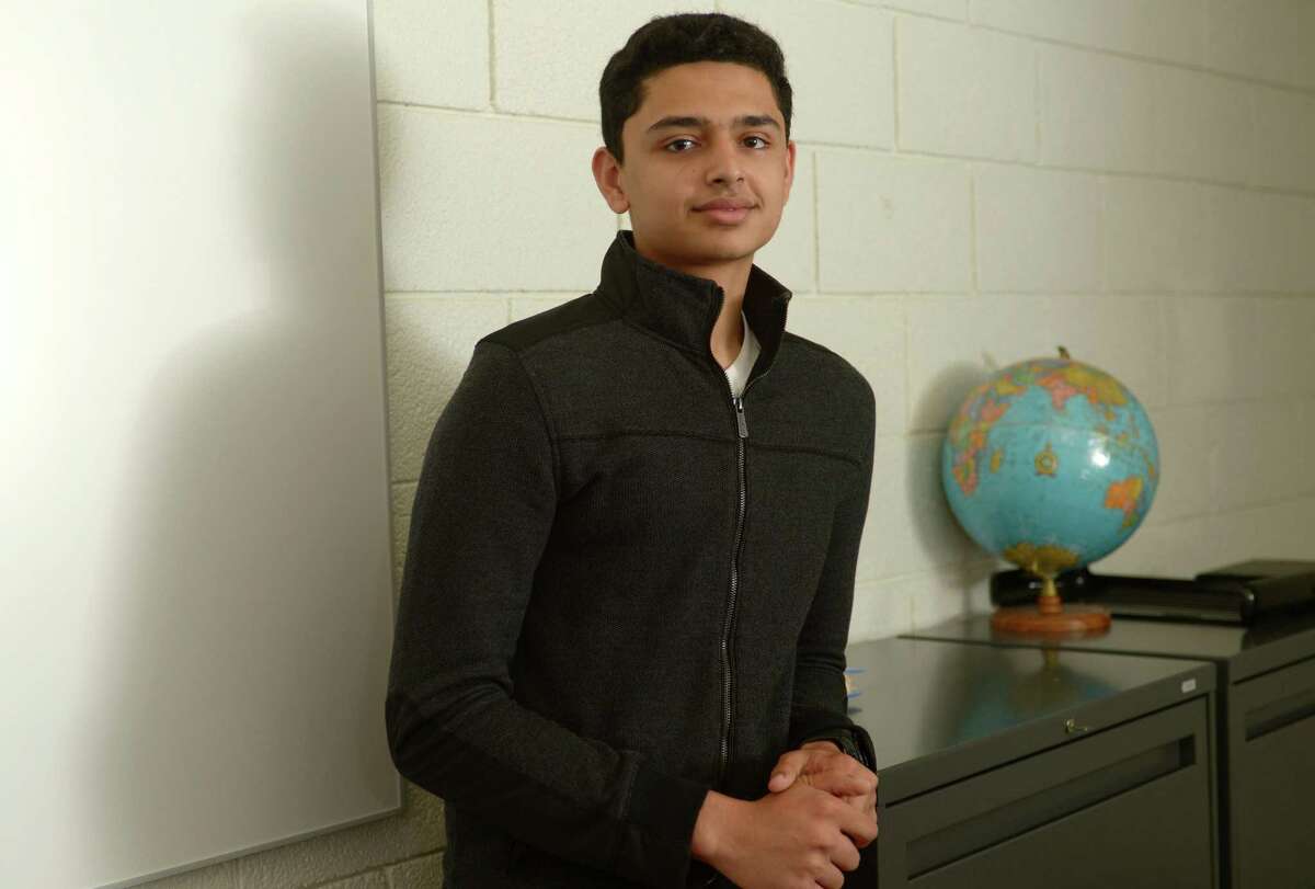 Aasim Vhora, a Norwalk High School senior who is part of the first graduating class of Norwalk Early College Academy at the school Wednesday, May 16, 2018, in Norwalk, Conn. Through NECA, Vhora was able to simultaneously earn an tuition-free associates degree in software engineering from NCC and a high school diploma from Norwalk High.