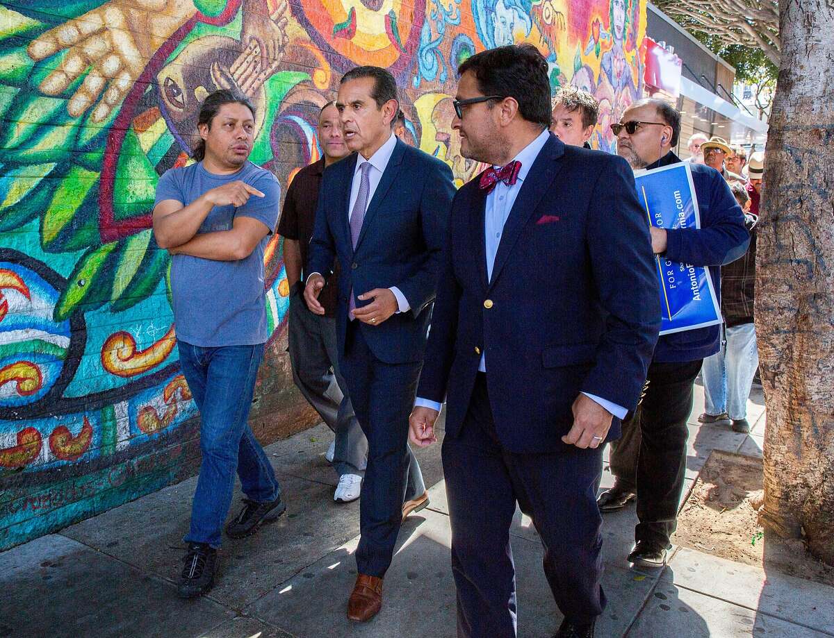 Democratic gubernatorial candidate and former Los Angeles Mayor Antonio Villaraigosa (center) walks with pedestrians and former member of the Board of Supervisors David Campos after a rally at Mission and 24th streets, Friday, May 11, 2018, in San Francisco, Calif. Villaraigosa earlier accepted an endorsement from Art Agnos, a former mayor of San Francisco.