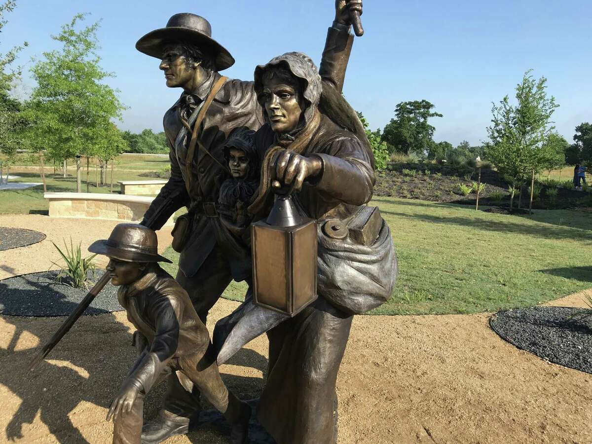 The sculpture greeting visitors to the new museum at San Felipe, by Texas sculptor Payne Lara, depicts the burning of the town during the Runaway Scrape.