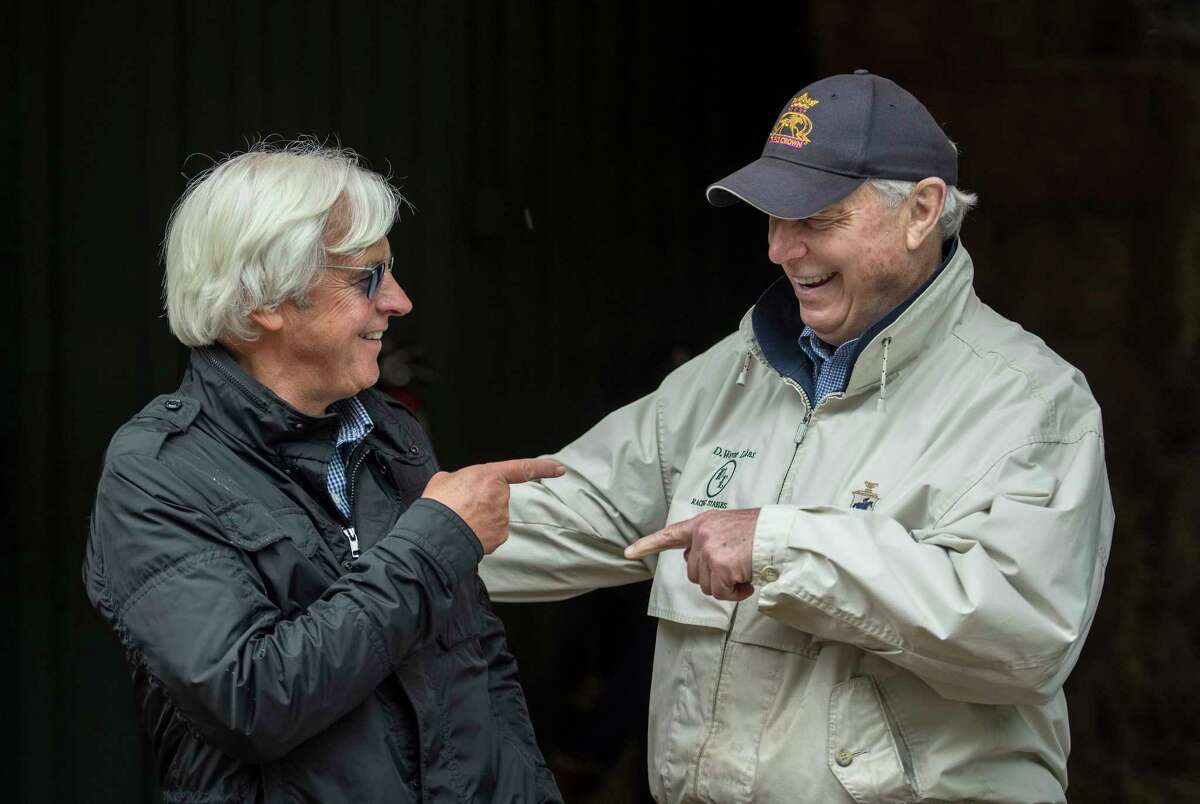 Justify's trainer Bob Baffert enjoys a funny moment with Bravazo and Sporting Chance's trainer D. Wayne Lukas at the Pimlico Race Course on Preakness Day Friday May 18, 2018 in Baltimore, MD. (Skip Dickstein/Times Union)