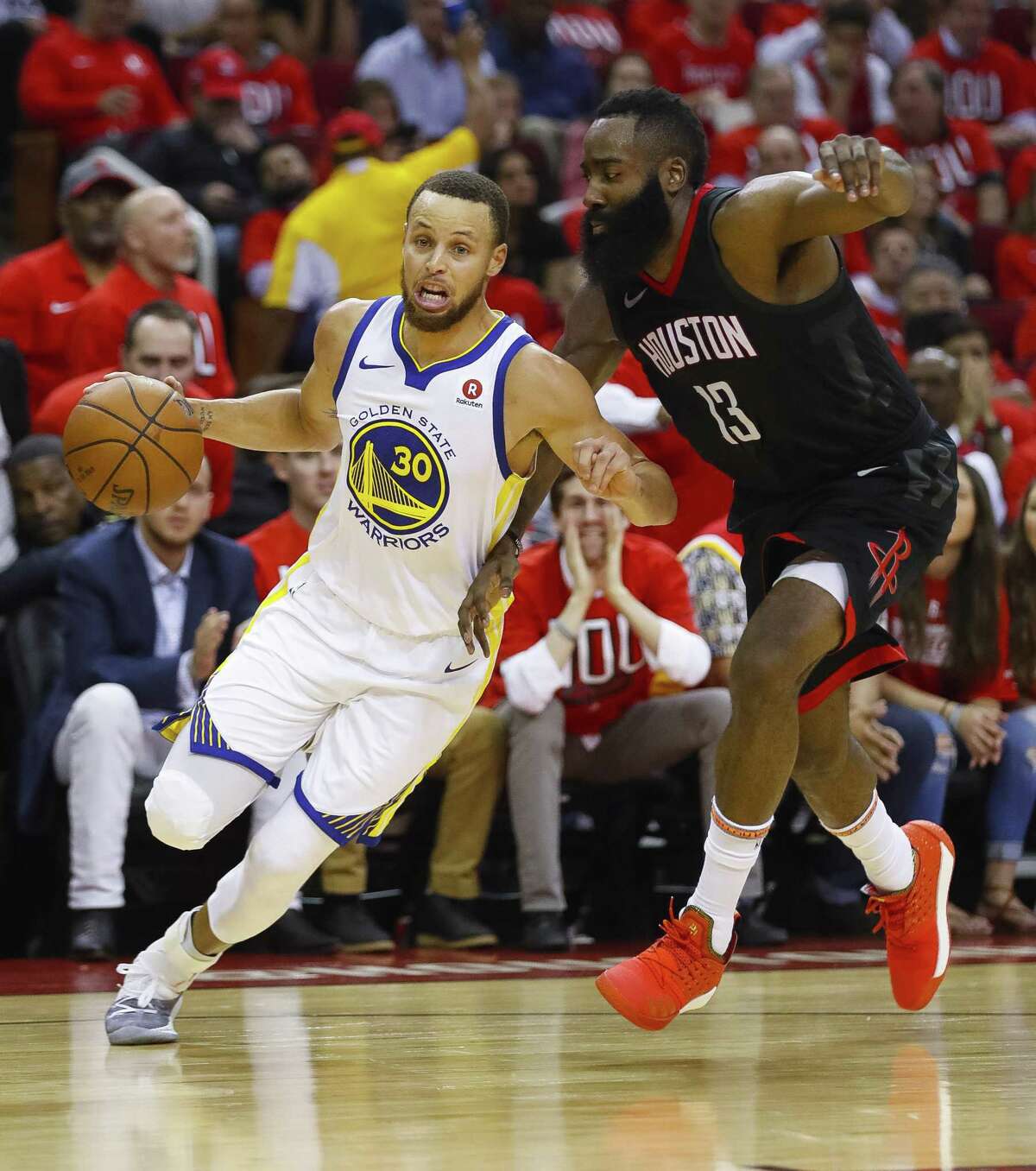Golden State Warriors guard Stephen Curry (30) drives past Houston Rockets guard James Harden (13) during the second half in Game 1 of the NBA Western Conference Finals at Toyota Center on Monday, May 14, 2018, in Houston. ( Brett Coomer / Houston Chronicle )