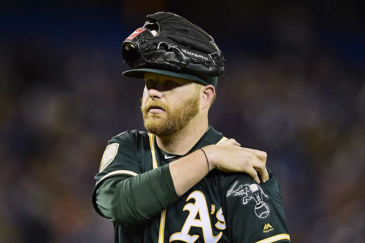 Oakland Athletics starting pitcher Brett Anderson leaves a baseball game while holding his shoulder in the second inning against the Toronto Blue Jays in Toronto on Friday, May 18, 2018. (Frank Gunn/The Canadian Press via AP)