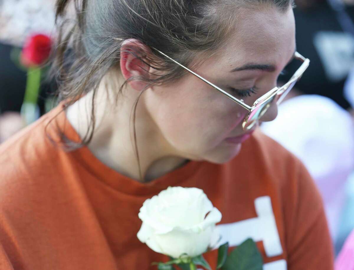 A tear rolls down a girl's face during a candlelight vigil for victims and survivors of the Santa Fe High School shooting at Texas First Bank on Friday, May 18, 2018, in Santa Fe. Hundreds participated and Gov. Greg Abbott and U.S. Sen. Ted Cruz also spoke at the vigil.