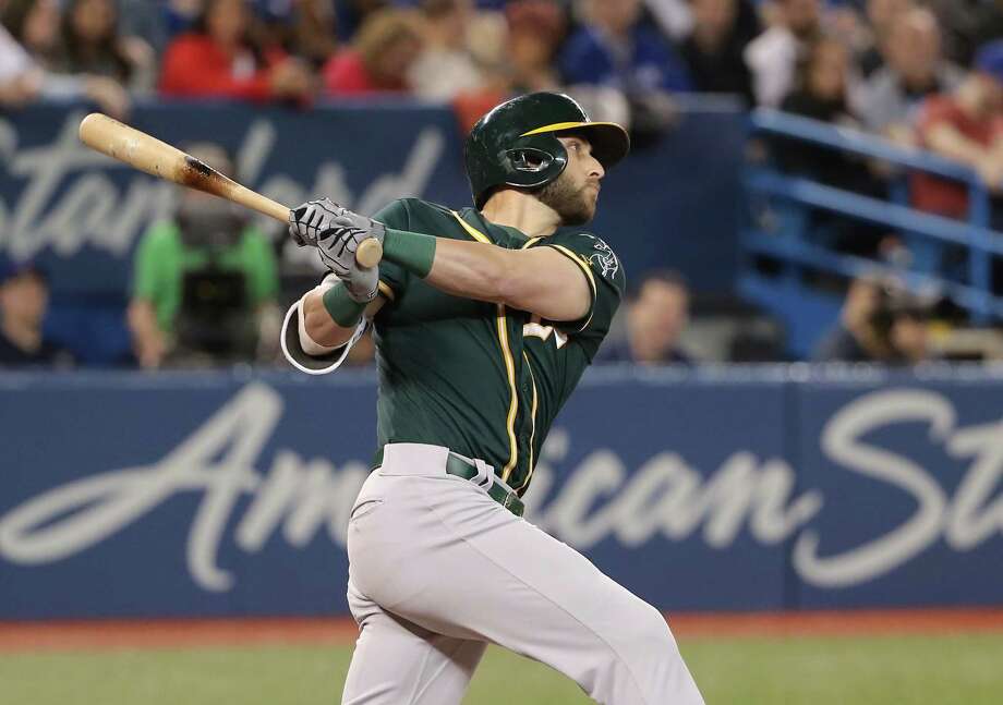 TORONTO, ON - MAY 18: Dustin Fowler #11 of the Oakland Athletics hits an RBI double in the seventh inning during MLB game action against the Toronto Blue Jays at Rogers Centre on May 18, 2018 in Toronto, Canada. (Photo by Tom Szczerbowski/Getty Images) Photo: Tom Szczerbowski / 2018 Getty Images