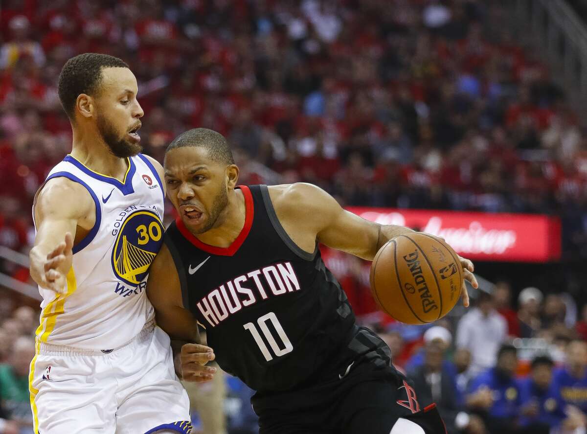 Houston Rockets guard Eric Gordon (10) drives around Golden State Warriors guard Stephen Curry (30) during the first half in Game 1 of the NBA Western Conference Finals at Toyota Center on Monday, May 14, 2018, in Houston. ( Brett Coomer / Houston Chronicle )