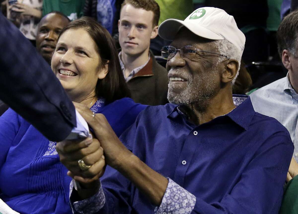 Boston Celtics legendary player Bill Russell is greeted at his seat before Game 1 of an NBA basketball second-round playoff series between the Boston Celtics and the Philadelphia 76ers, Monday, April 30, 2018, in Boston. (AP Photo/Elise Amendola)