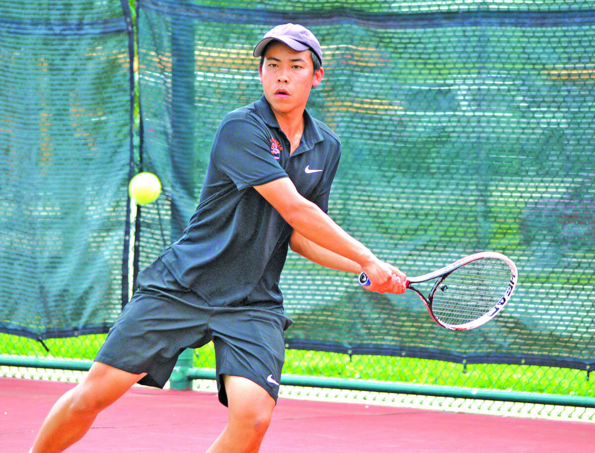 Edwardsville senior Jason Pan returns a shot during his doubles quarterfinal with partner Logan Pursell on Saturday during the Class 2A Belleville East Sectional.
