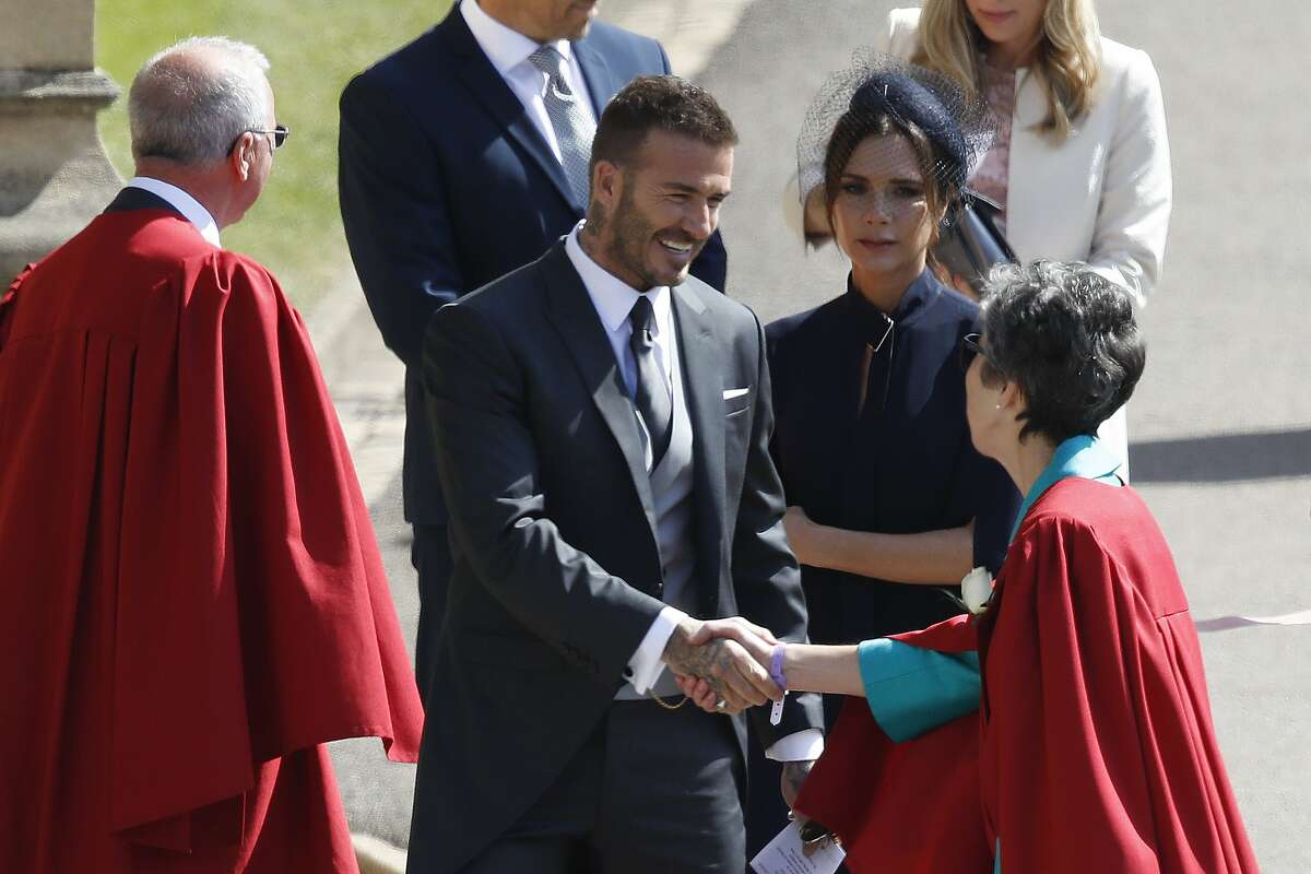 David and Victoria Beckham arrive for the wedding ceremony of Prince Harry and Meghan Markle at St. George's Chapel in Windsor Castle in Windsor, near London, England, Saturday, May 19, 2018. (Odd Anderson/pool photo via AP)