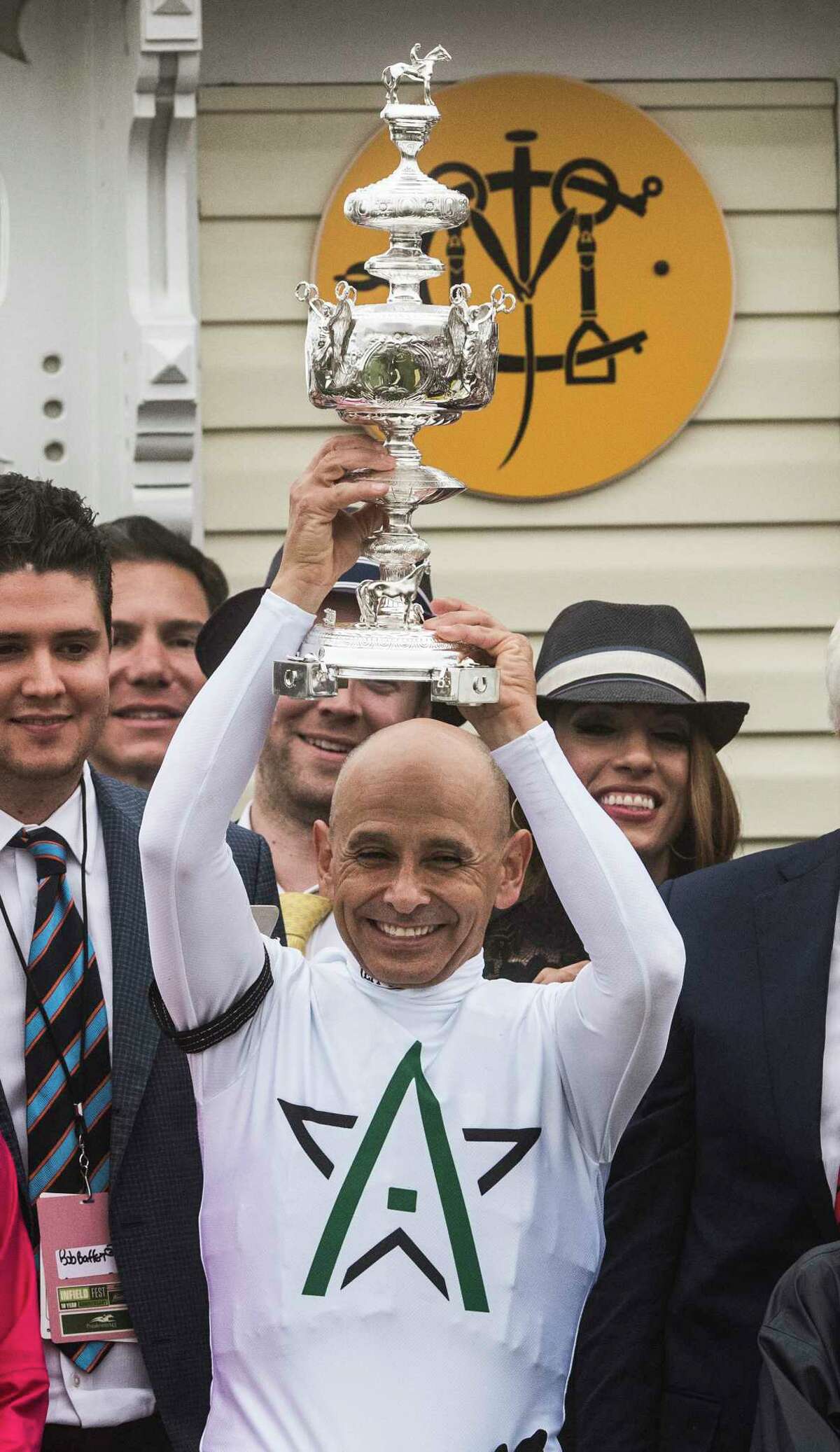 Jockey Mike Smith holds the winner's trophy aloft after Justify won the 143rd running of the Preakness Stakes at the Pimlico Race Course on Preakness Day Saturday May 19, 2018 in Baltimore, MD. (Skip Dickstein/Times Union)